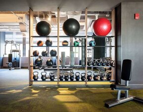 Fully equipped fitness center at Hilton Chicago O'Hare Airport.