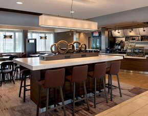 Dining area and workspace at Sonesta Select Boston Milford.