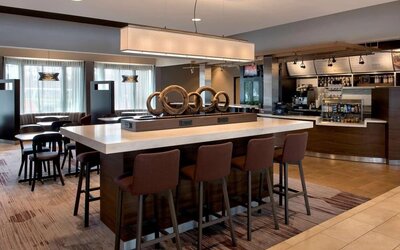 Dining area and workspace at Sonesta Select Boston Milford.