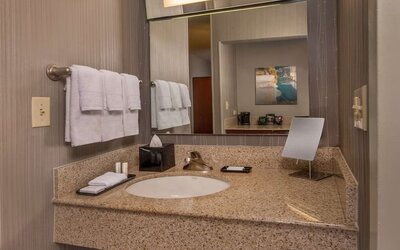 Private guest bathroom with free toiletries at Sonesta Select Arlington Rosslyn.