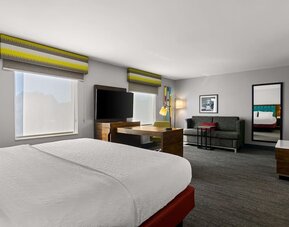 Spacious hotel suite with king size bed and working station at Hampton Inn & Suites Schererville.