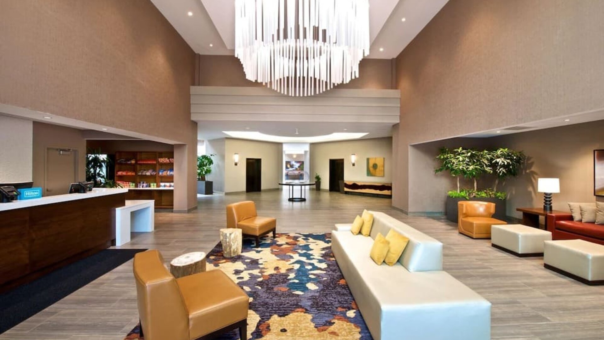 Lobby and coworking lounge at Embassy Suites By Hilton Seattle-North-Lynnwood.