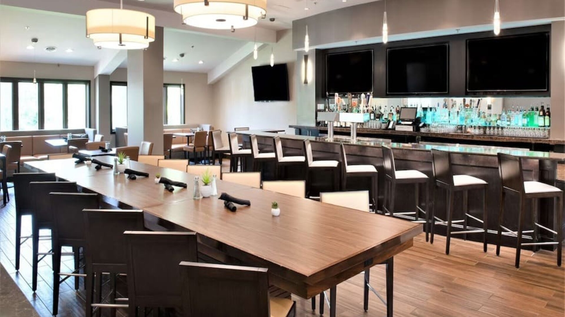 Bright-lit hotel bar at Embassy Suites By Hilton Seattle-North-Lynnwood.