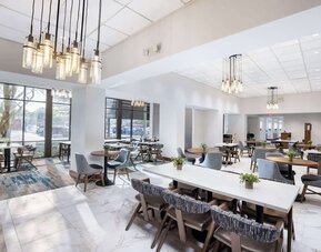 Dining area perfect for coworking at Doubletree By Hilton Houston Medical Center Hotel & Suites.