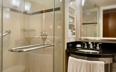 Guest bathroom with shower at New York Hilton Midtown.