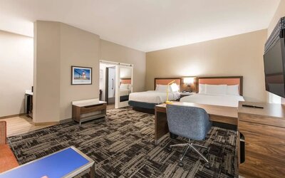 Day use twin room with workspace and private guest bathroom at Hampton Inn & Suites Benton Harbor.