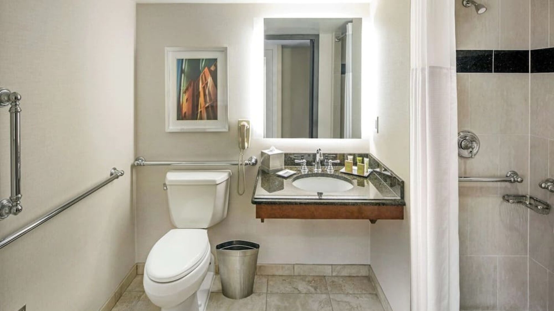 Private guest bathroom with shower and free toiletries at Hilton Minneapolis.