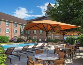 Outdoor pool and lounge area at Sonesta Select Boston Lowell Chelmsford.