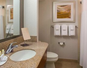 Private guest bathroom with shower and free toiletries at Sonesta Select Boston Lowell Chelmsford.