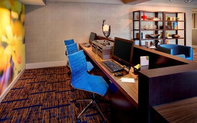 Business center with computers, printer and ergonomic chairs at Sonesta Select Boston Danvers.