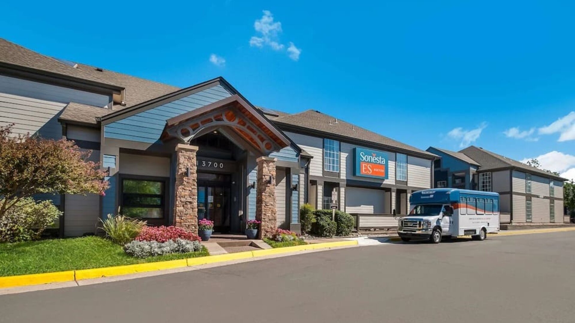 Entrance and parking area at Sonesta ES Suites Dulles Airport.