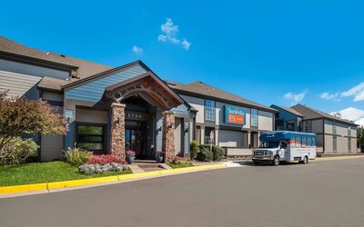 Entrance and parking area at Sonesta ES Suites Dulles Airport.