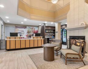Lobby lounge with fireplace at Sonesta ES Suites Dulles Airport.
