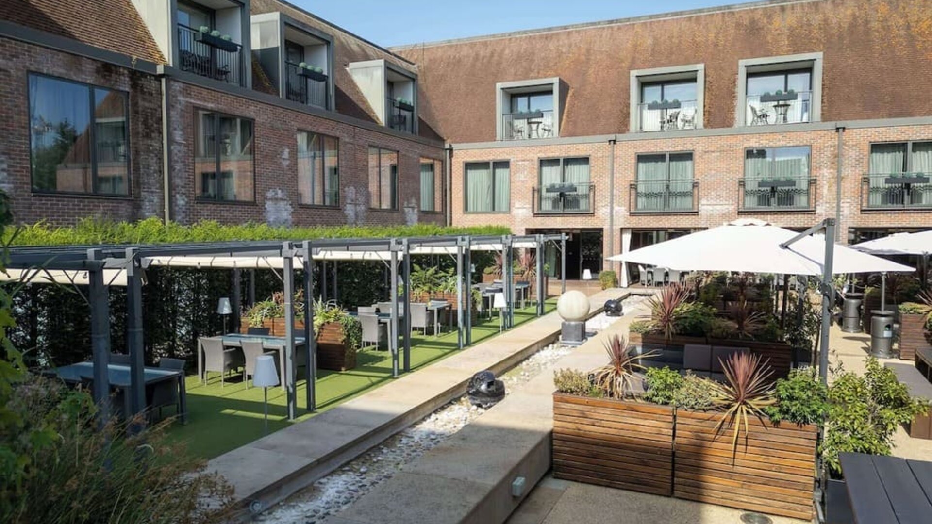 Hotel terrace and garden at Hilton London Syon Park.