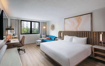 Bright and spacious day use room with work des at Sonesta Miami Airport.