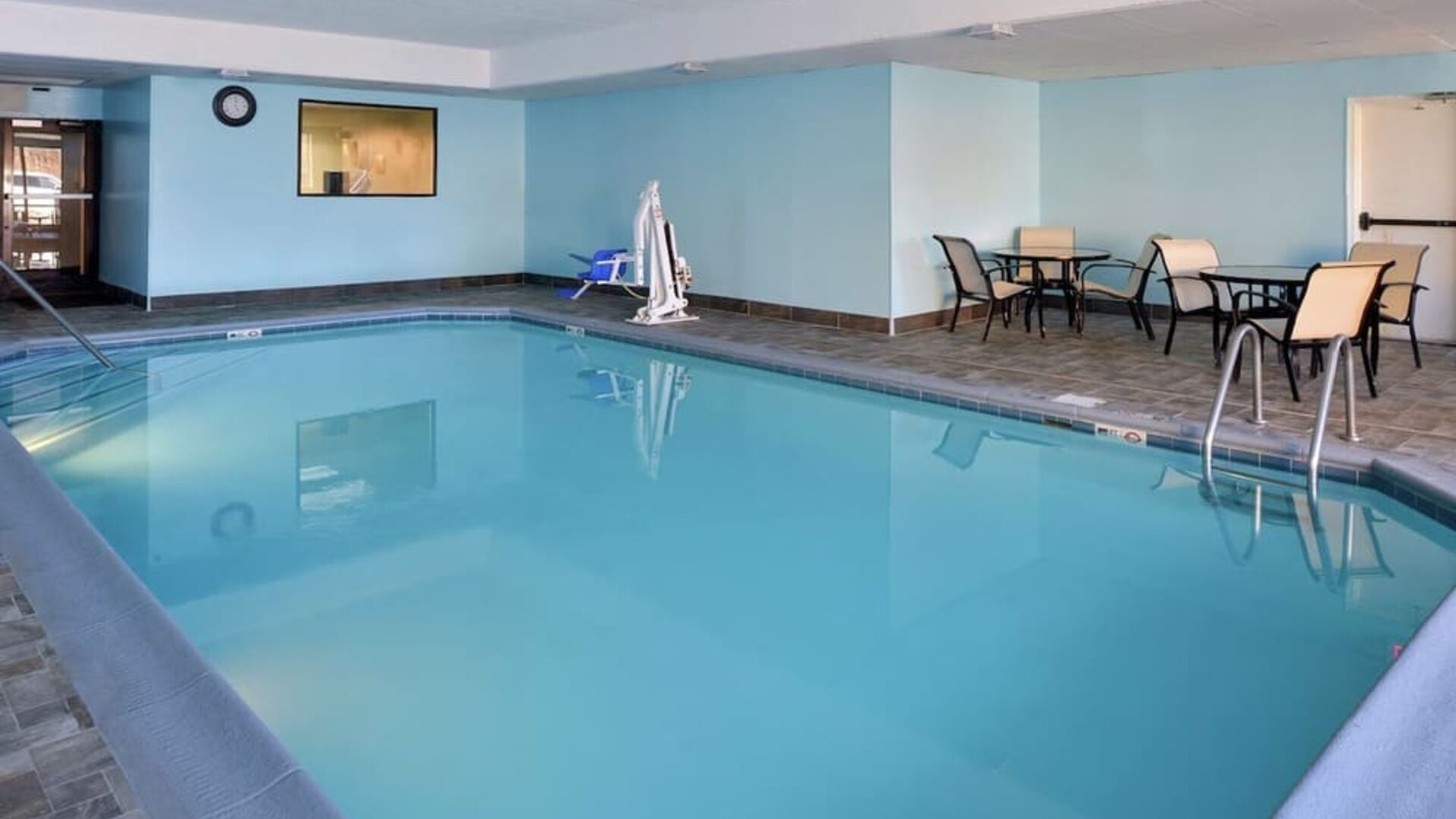 Indoor heated pool with lounge chairs at Hampton Inn Columbus-East.