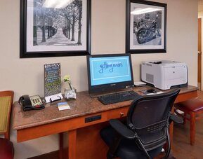 Business center with computer, printer and ergonomic chair at Hampton Inn Columbus-East.
