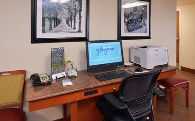 Business center with computer, printer and ergonomic chair at Hampton Inn Columbus-East.