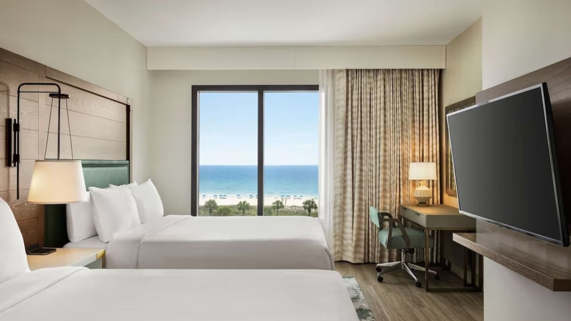 Day use twin room with sea view, work desk and private bathroom at Embassy Suites By Hilton Panama City Beach Resort.