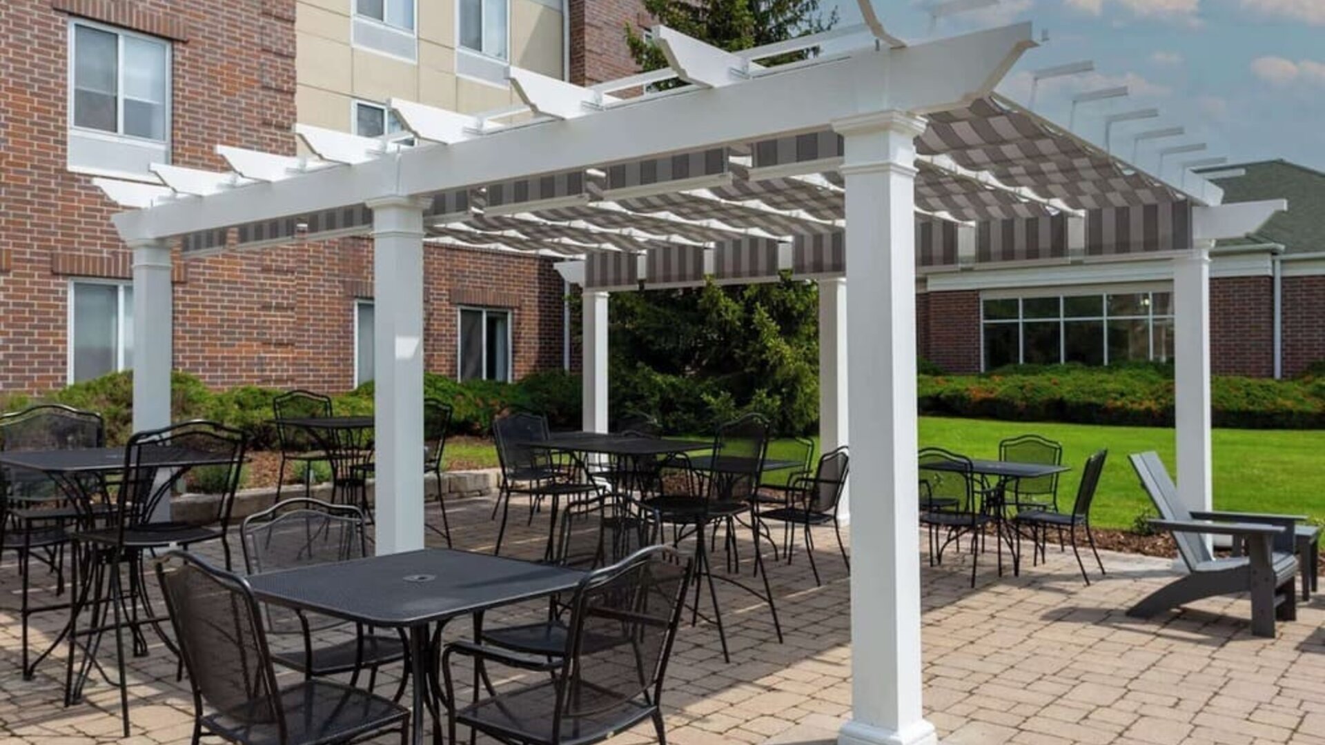 Hotel patio with seating area at Hilton Garden Inn Milwaukee Northwest Conference Center.