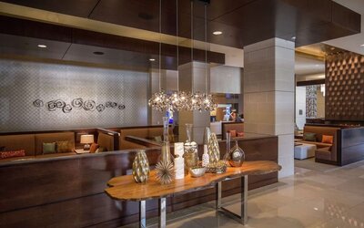 Lobby and coworking lounge at Hilton Dallas/ Plano Granite Park.