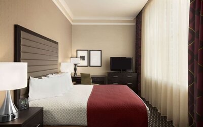 Day use room with work desk and natural light at Embassy Suites By Hilton St. Louis Downtown.