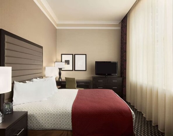 Day use room with work desk and natural light at Embassy Suites By Hilton St. Louis Downtown.