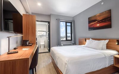 Day use room with work desk and natural light at Liberty View Brooklyn Hotel.