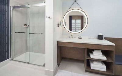 Guest bathroom with shower at The Chifley Houston, Tapestry Collection By Hilton.