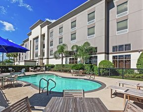 Outdoor pool at Hampton Inn & Suites Houston-Bush Intercontinental Aprt.