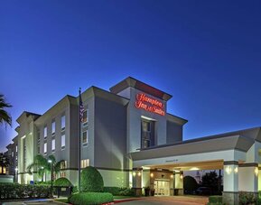 Hotel exterior at night at Hampton Inn & Suites Houston-Bush Intercontinental Aprt.