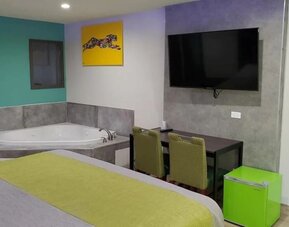 Day use room with TV at Exclusivo Inn & Suites. 