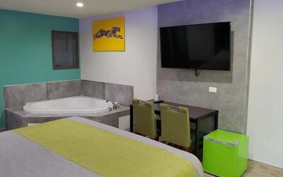 Day use room with TV at Exclusivo Inn & Suites. 