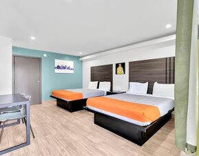 Day use room with TV at Exclusivo Inn & Suites. 