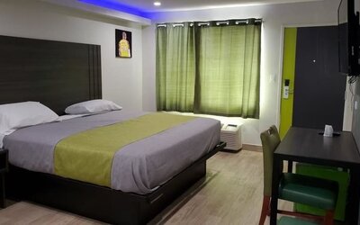 Day use room with TV at Exclusivo Inn & Suites. 