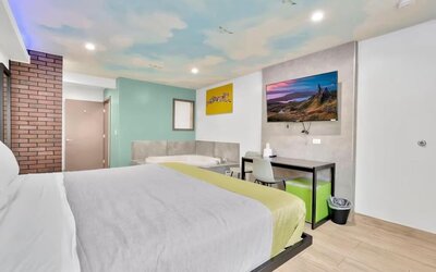 Day use room with TV at Exclusivo Inn & Suites. 