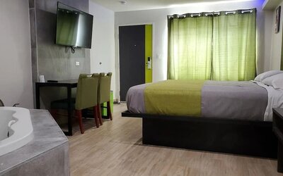 Day use room with TV at Exclusivo Inn & Suites. 