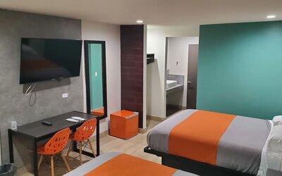 Day use room with TV at Exclusivo Inn & Suites. 