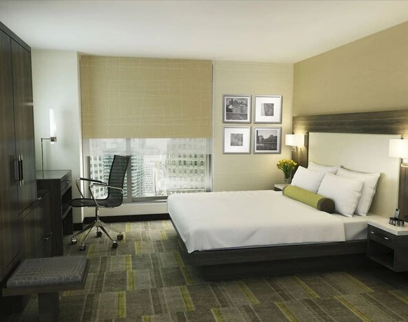 Bright and spacious day use room with work desk at Hilton Garden Inn New York/Times Square Central.