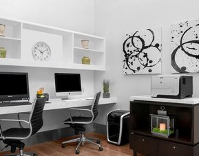 Business center with computers, printer and ergonomic chairs at Hilton Garden Inn New York/Times Square Central