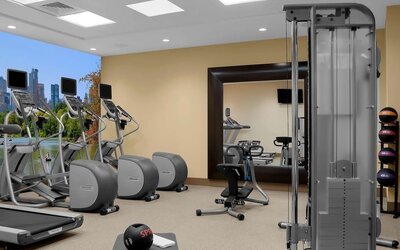 Fully equipped fitness center at Hilton Garden Inn New York/Times Square Central.