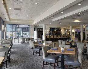 Dining area with comfortable seating at Hotel Tampa Riverwalk.