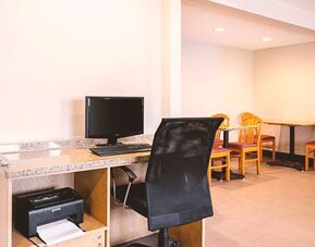 Business center with computer, printer and ergonomic chair at Hotel Inn Milwaukee.