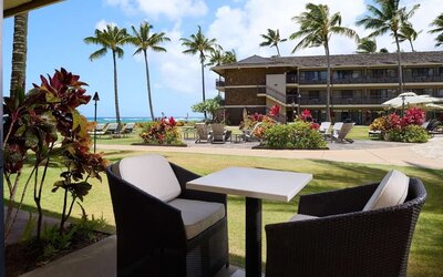 Outdoor lounge seating at Ko'a Kea Resort On Po`ipu Beach.