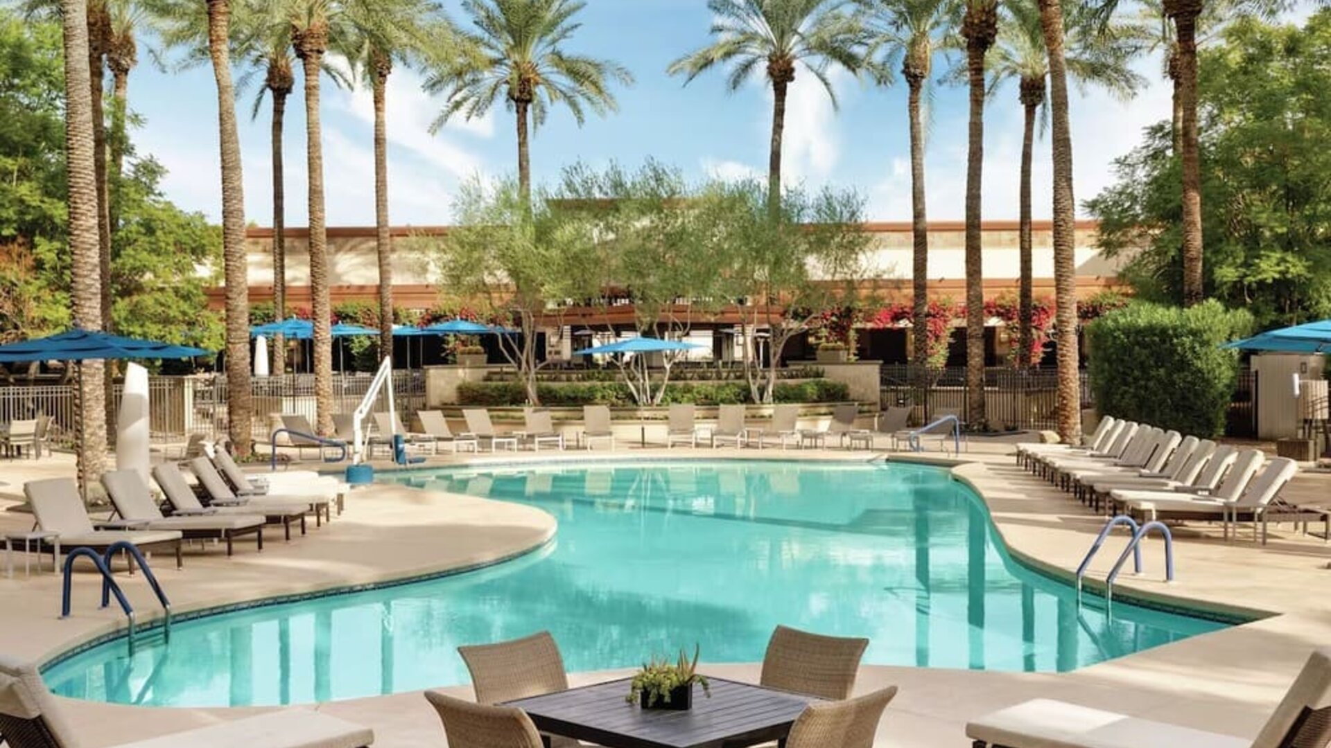 Outdoor pool and lounge chairs at Hilton Scottsdale Resort & Villas.