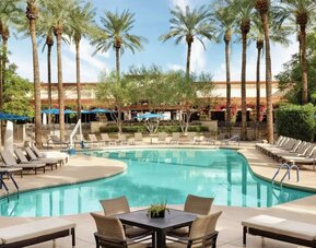 Outdoor pool and lounge chairs at Hilton Scottsdale Resort & Villas.