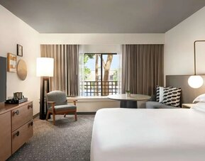 Day use room with workspace and TV screen at Hilton Scottsdale Resort & Villas.
