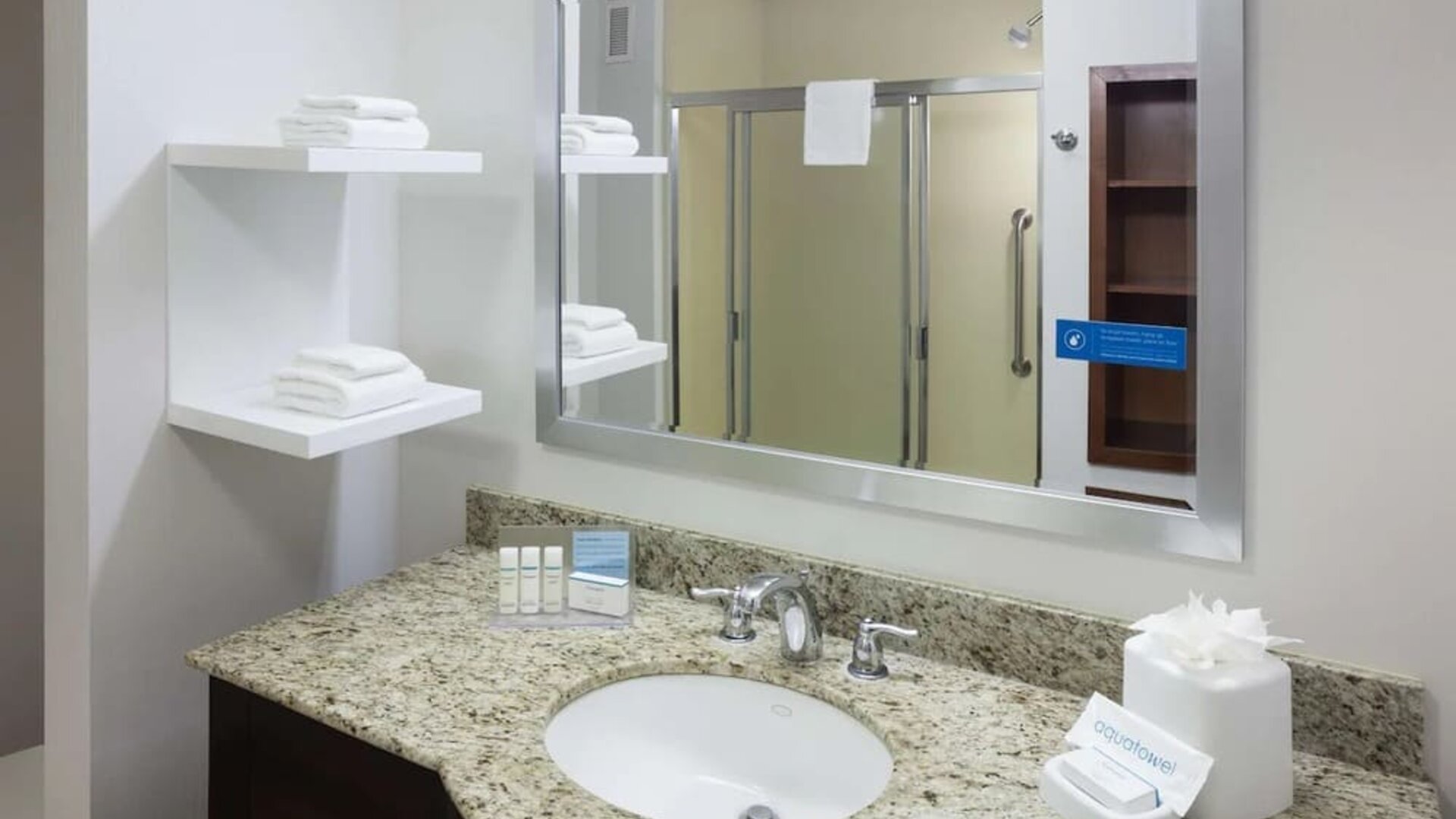 Private guest bathroom with shower and free toiletries at Hampton Inn Los Angeles-Orange County-Cypress.