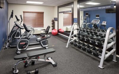 Fully equipped fitness center at Hampton Inn Los Angeles-Orange County-Cypress.