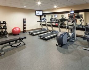 Fully equipped fitness center at Homewood Suites By Hilton Agoura Hills.